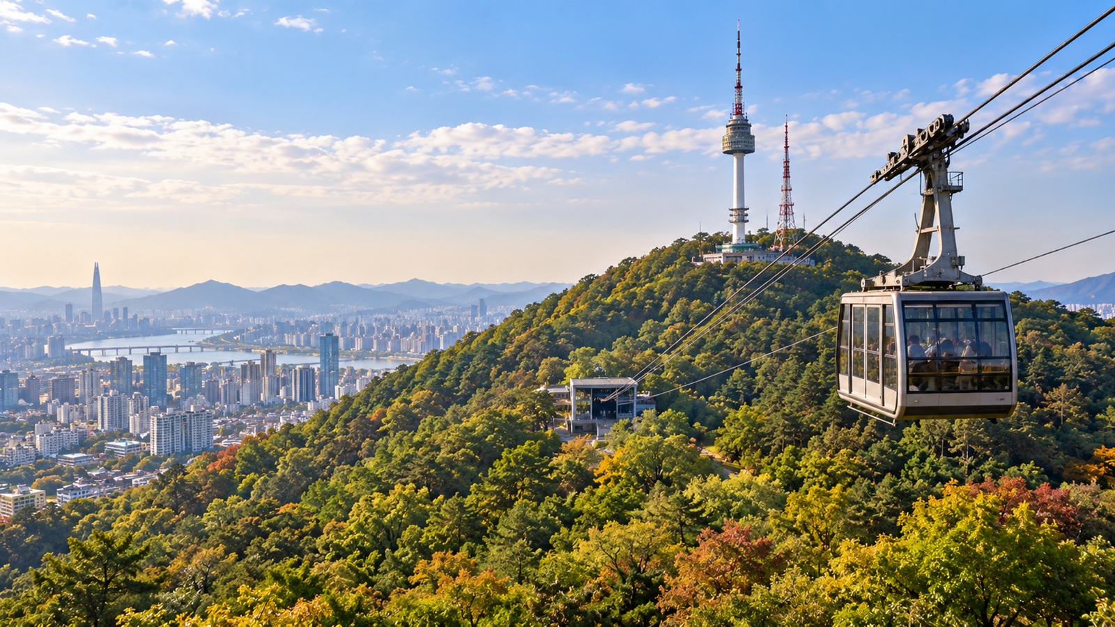 Cable car traveling above Namsan Mountain toward N Seoul Tower.